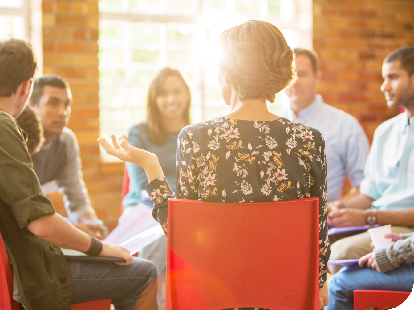 Group of individuals talking in a circle