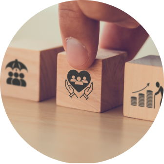 Finger picking up small wood blocks