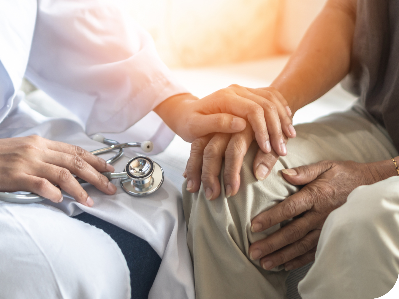 Doctor sitting with patient