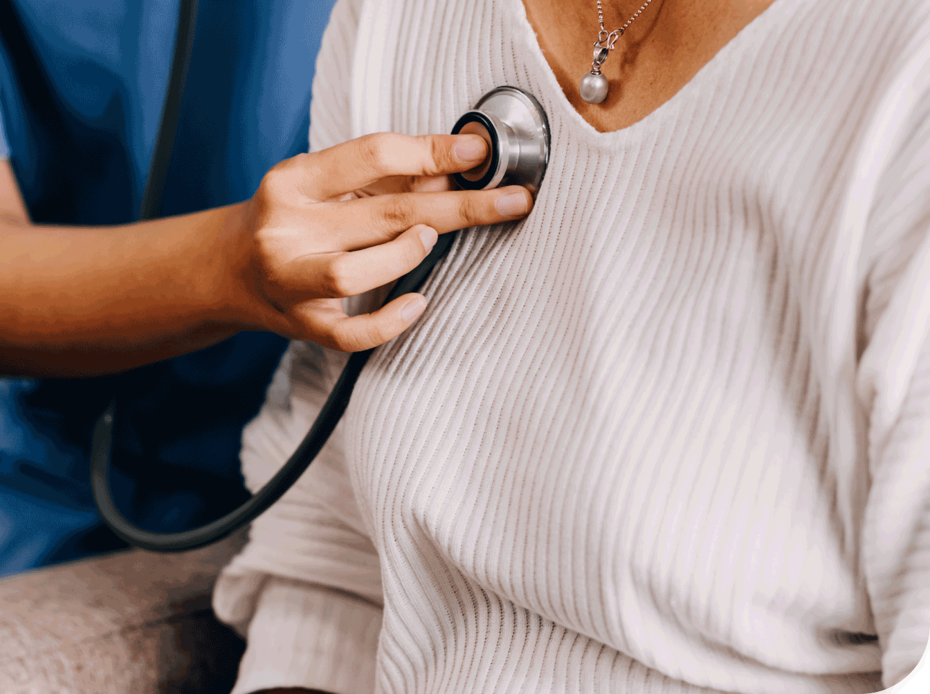 Nurse listening to patients chest