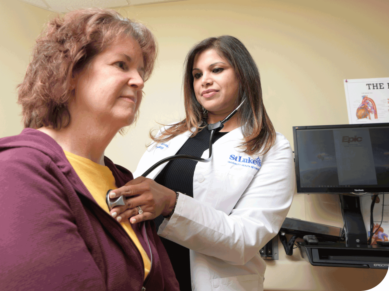 Doctor listening to patient's heart