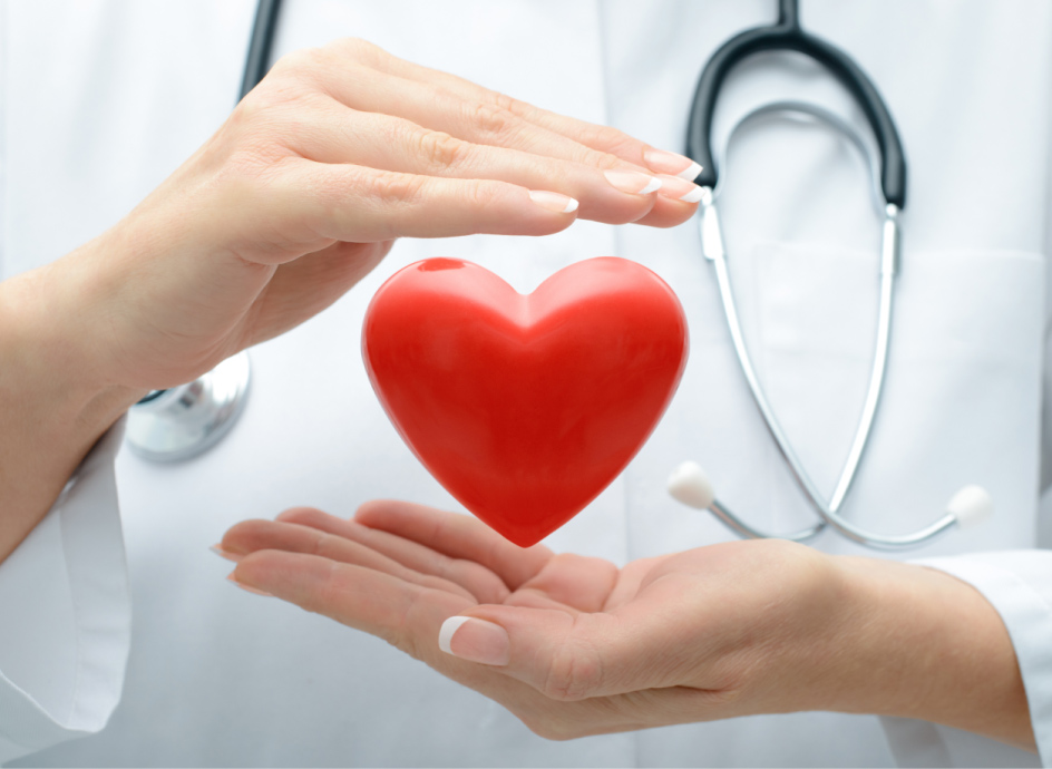Medical Professional with hands around a heart