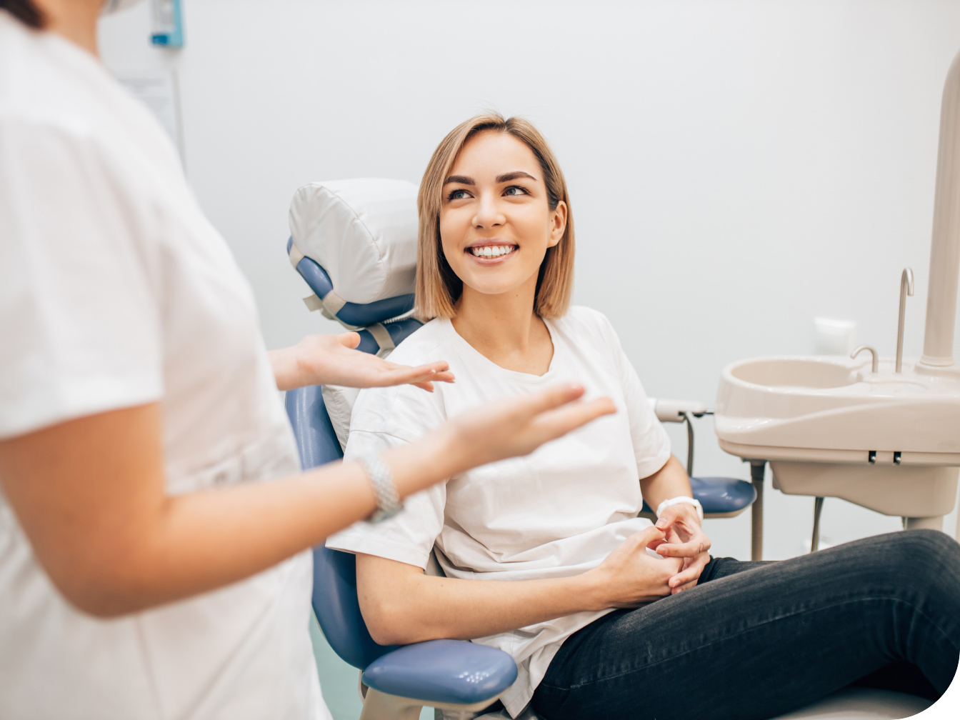 Individual sitting in a dental chair