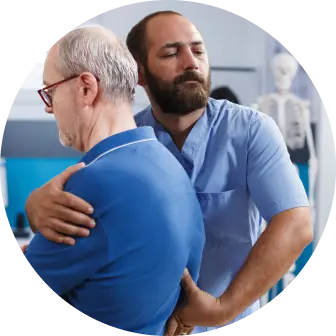 Chiropractor adjusting patient's back