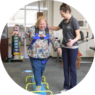 Physical Therapist helping patient walk