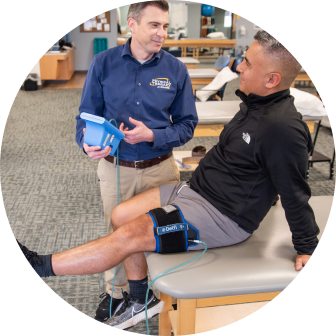 Physical Therapist talking with a patient