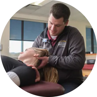 Physical Therapist helping stretch a patient