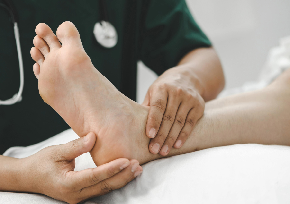 Physical Therapist checking out patient's ankle