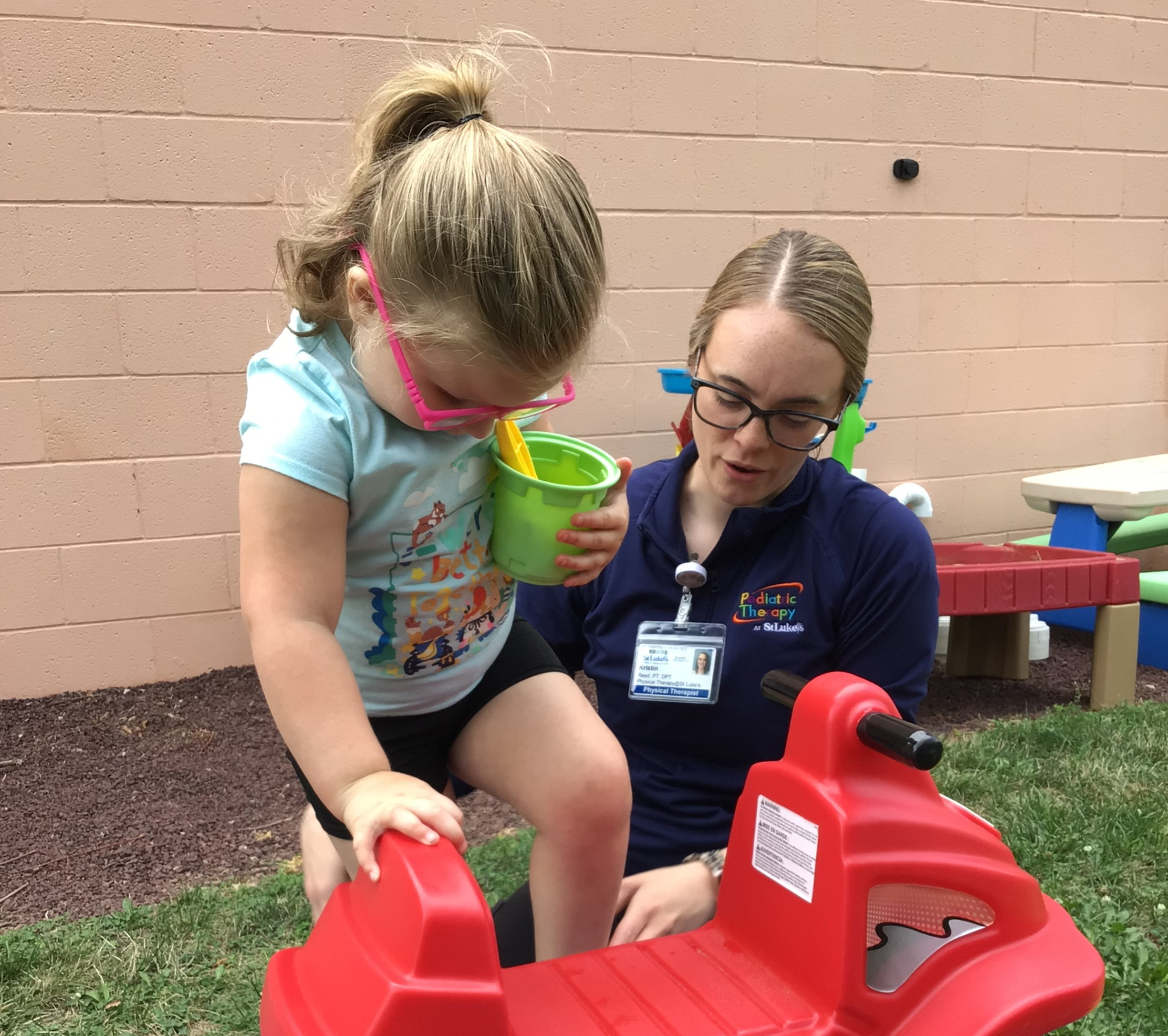 Physical Therapist working with a young child