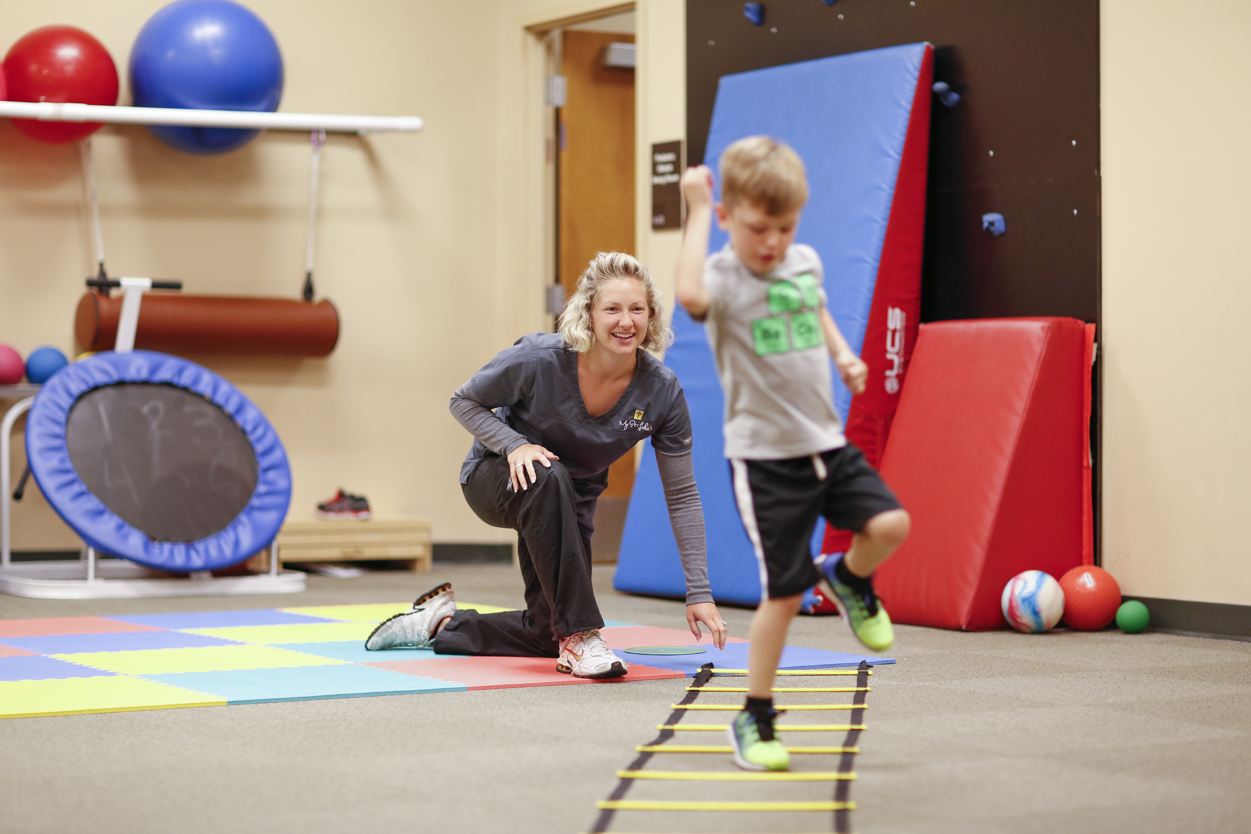Physical Therapist playing with a young child