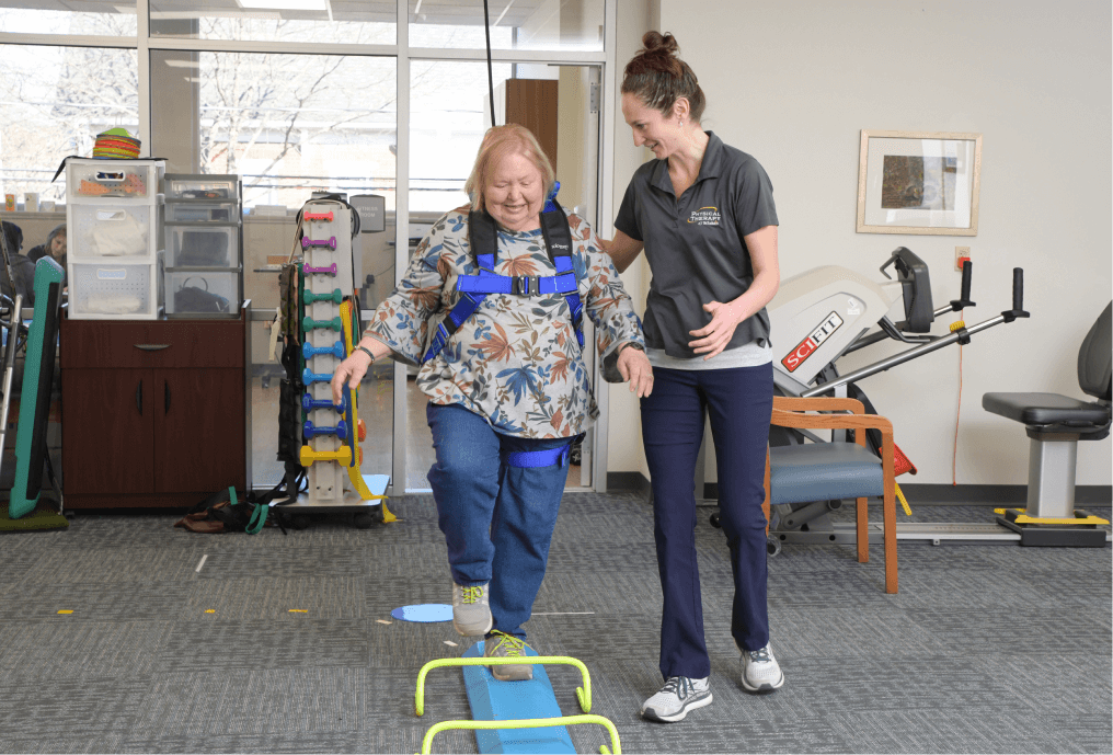 Physical Therapist assisting patient