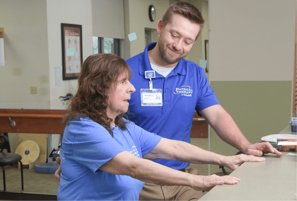 Physical Therapist assisting patient