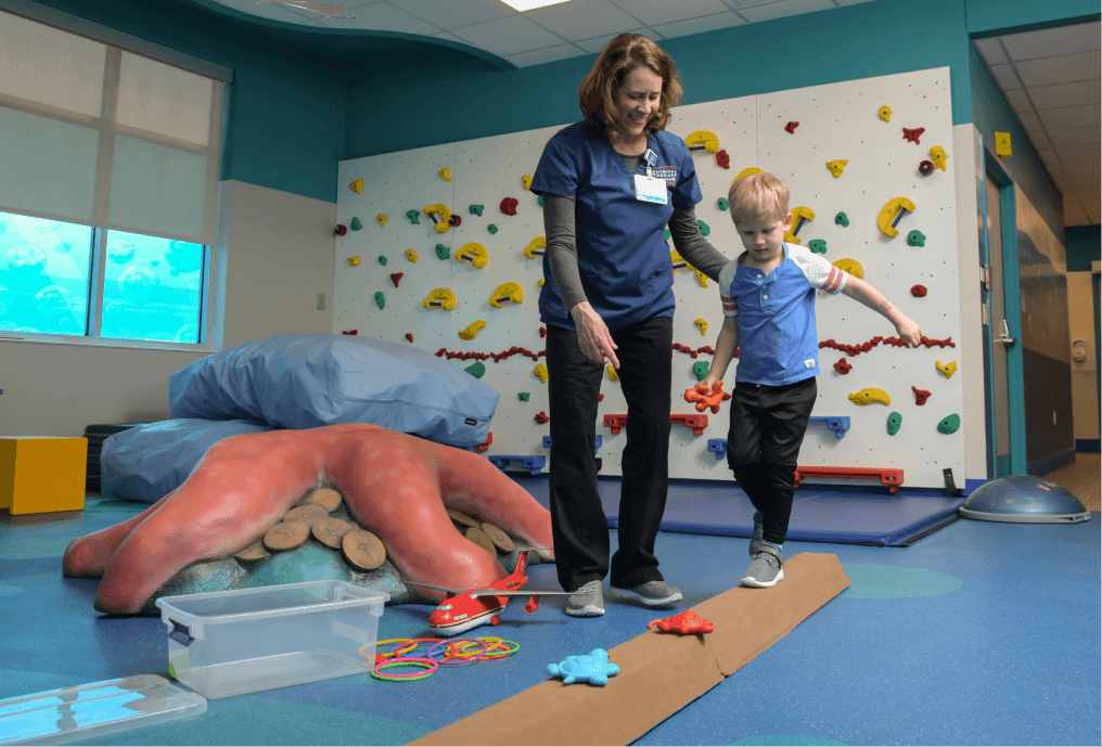 Physical Therapist working with young child