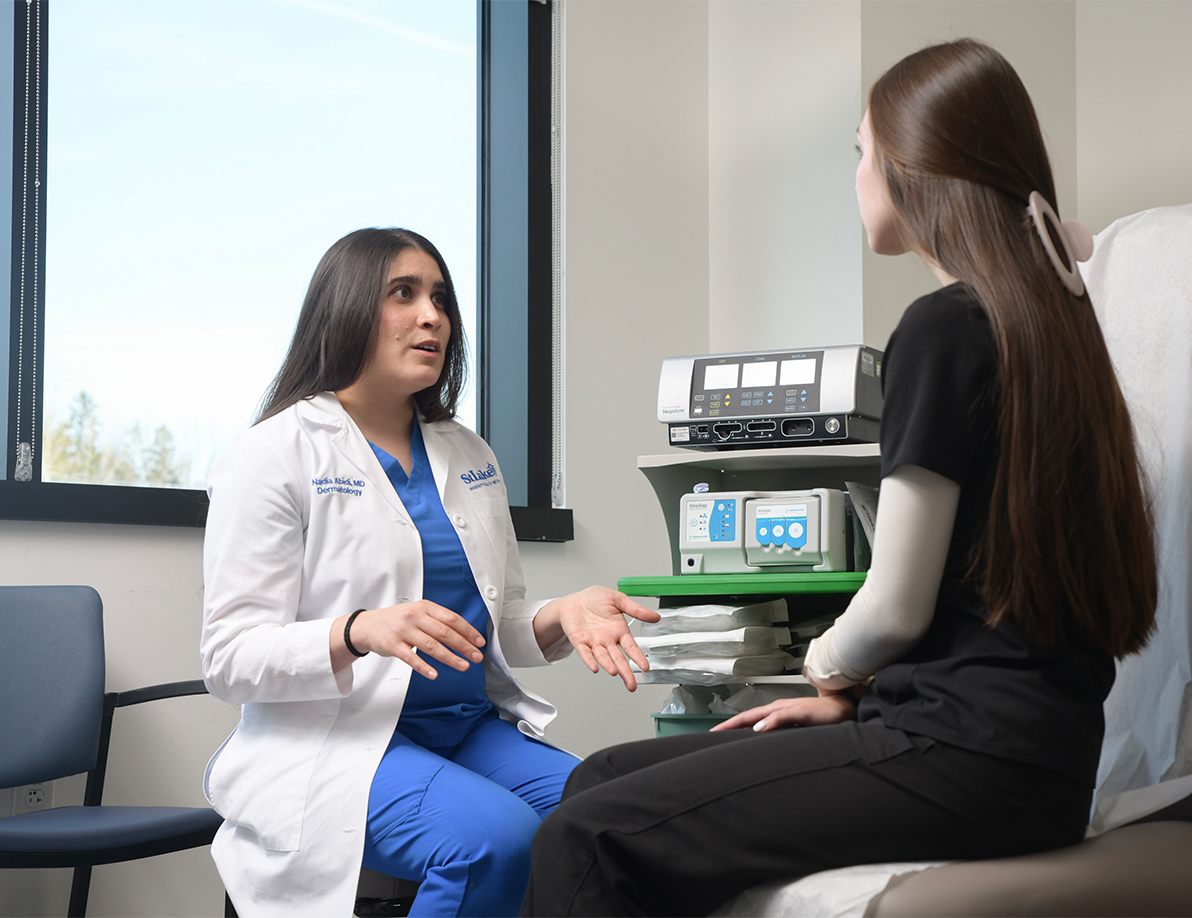 Medical professional talking with a patient