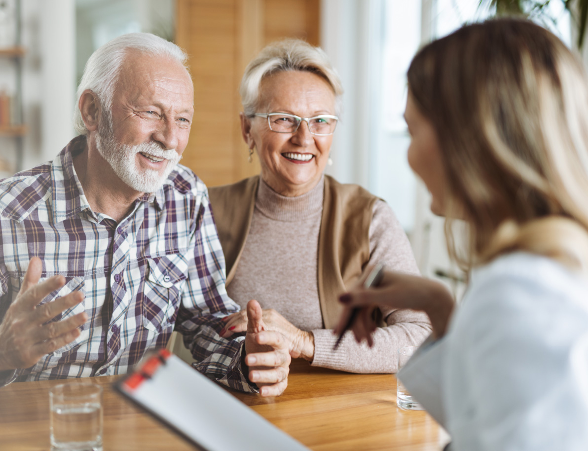 Medical professional going over paper work with patients