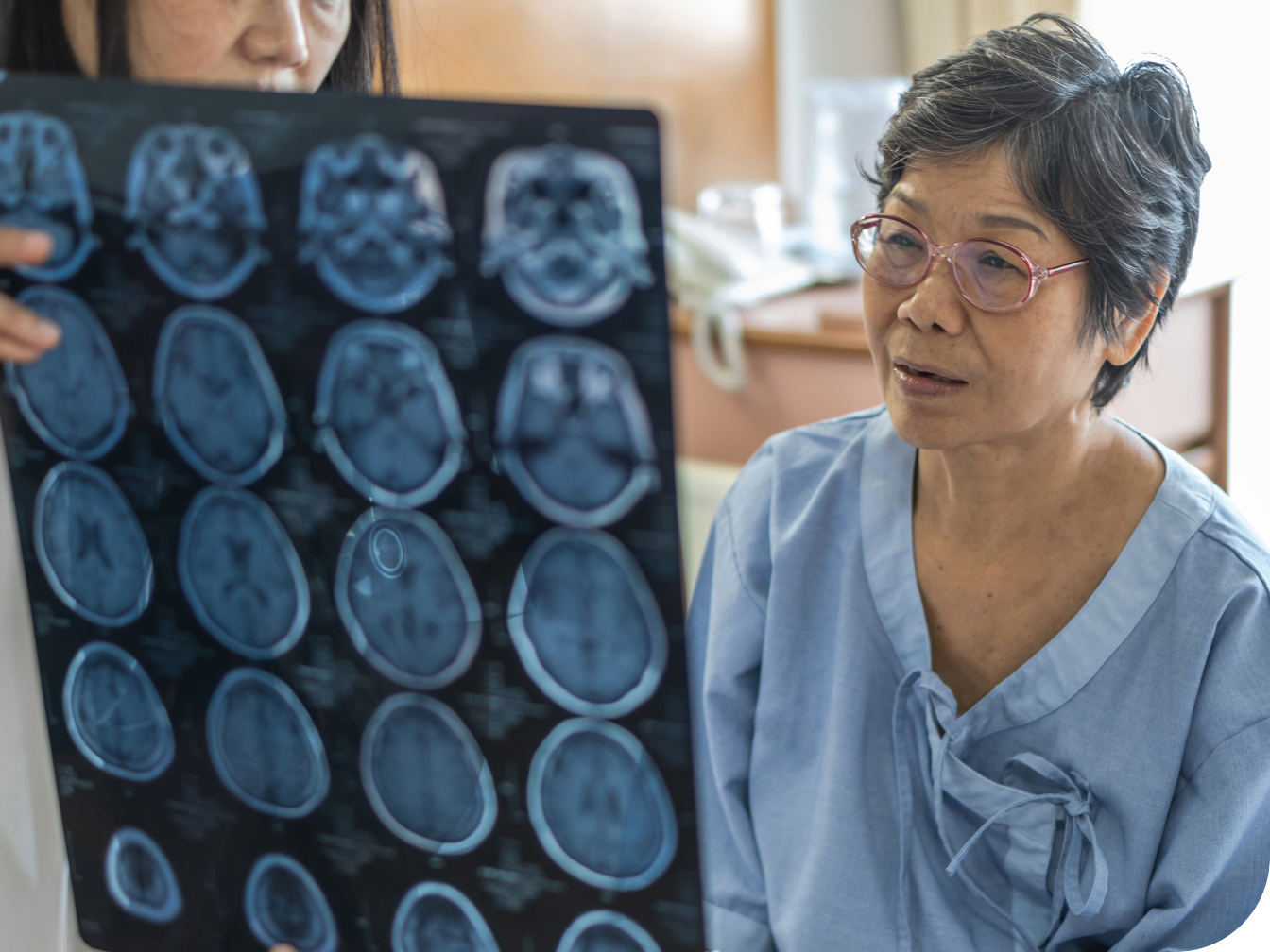 Medical professional showing a patient their medical scan results