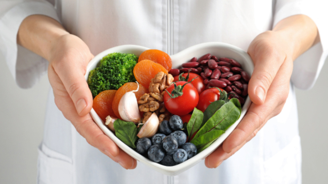 Colorful salad in a heart shaped bowl