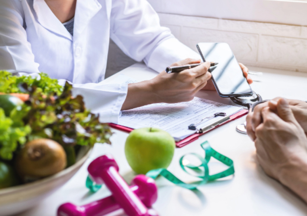 Medical professional reviewing healthy food options with a patient