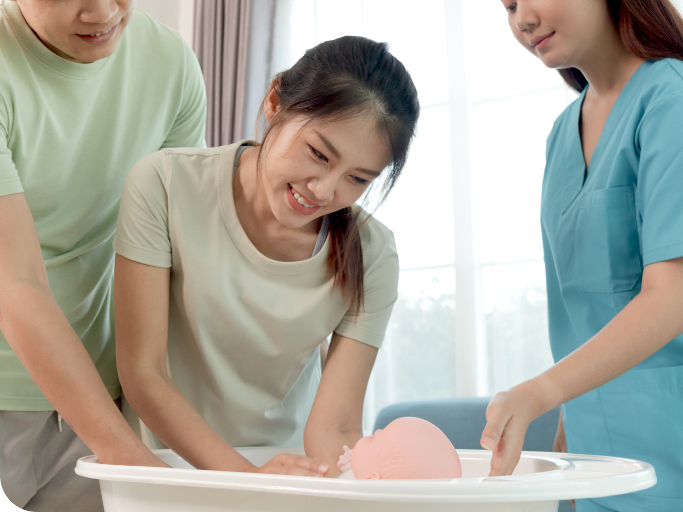 New mother learning how to give baby a bath