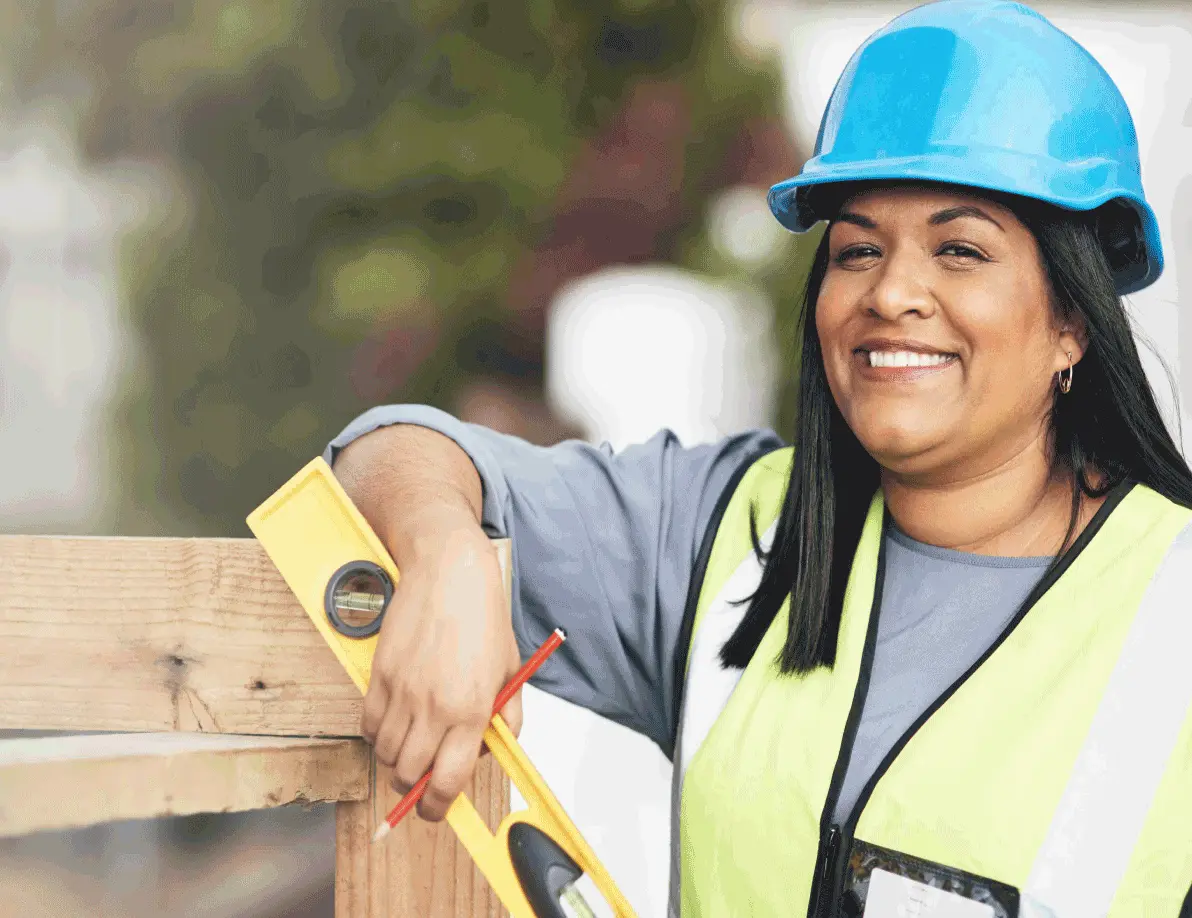 Female construction worker with safety vest and hard hat