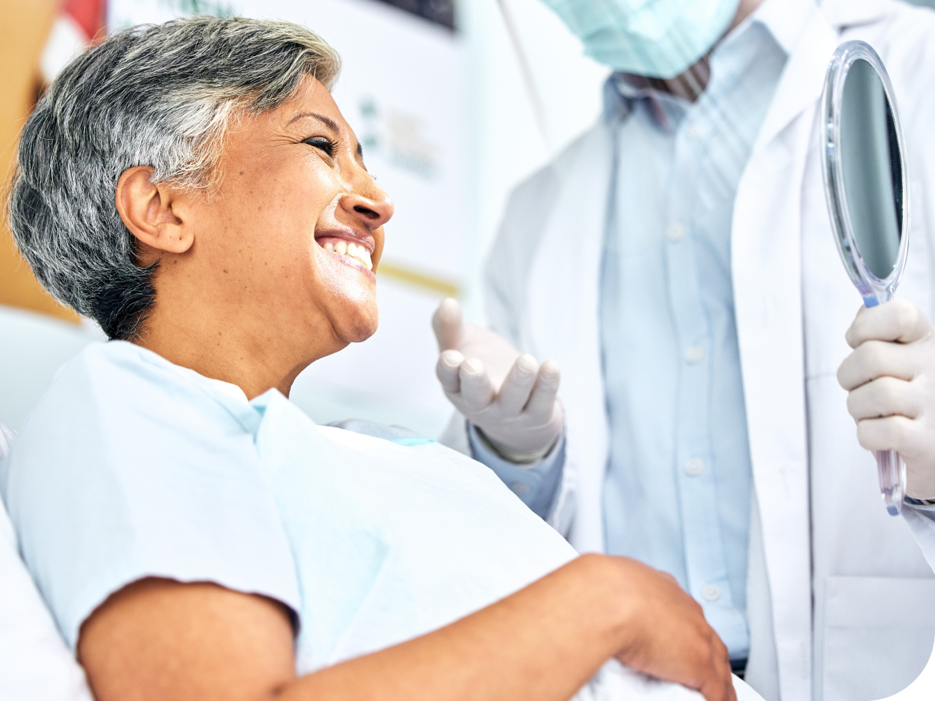 Women smiling in a dental chair
