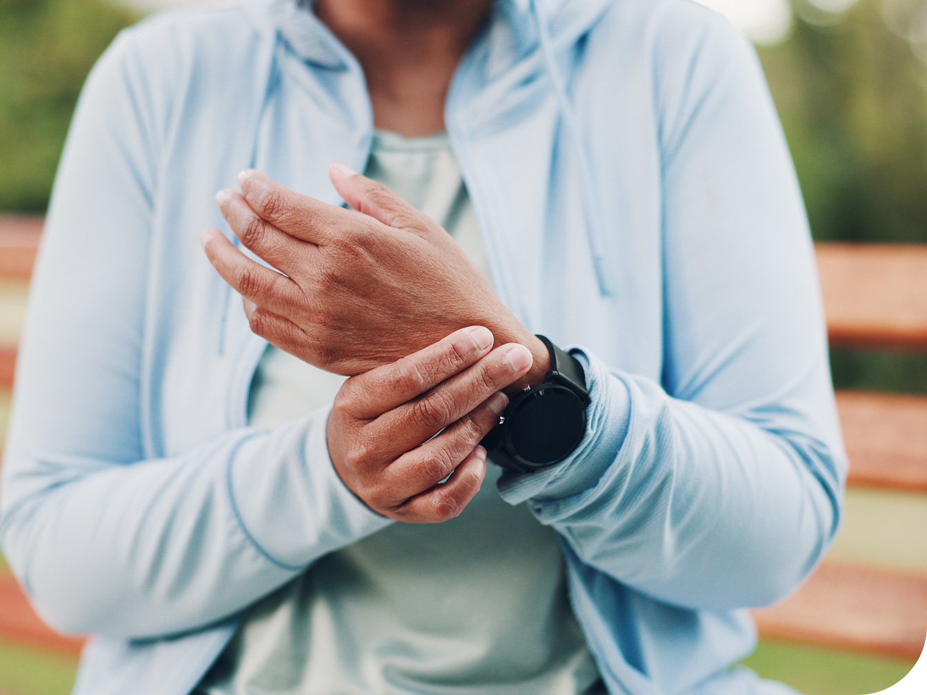 Individual holding wrist