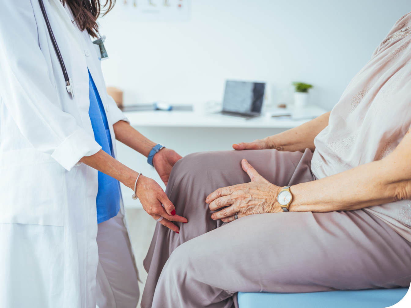 Medical professional checking out a patient's knee