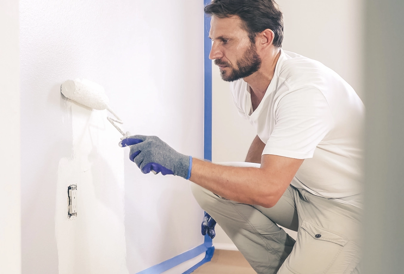 Male painting a room