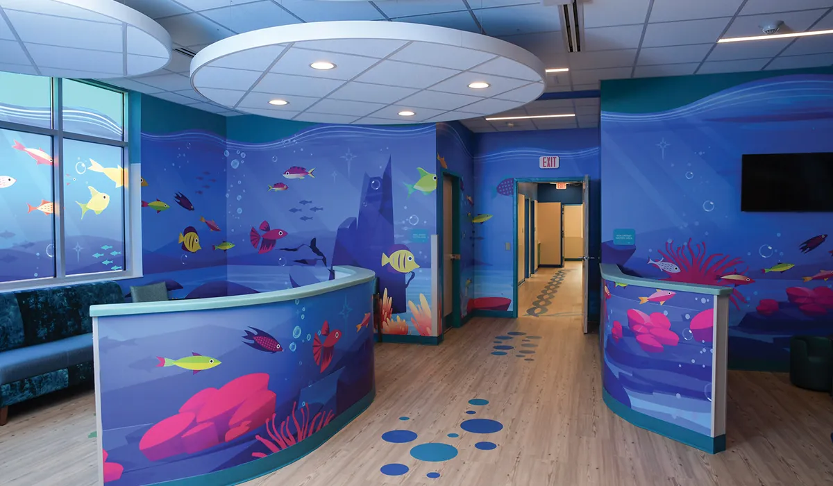 Medical room with a colorful underwater theme with benches