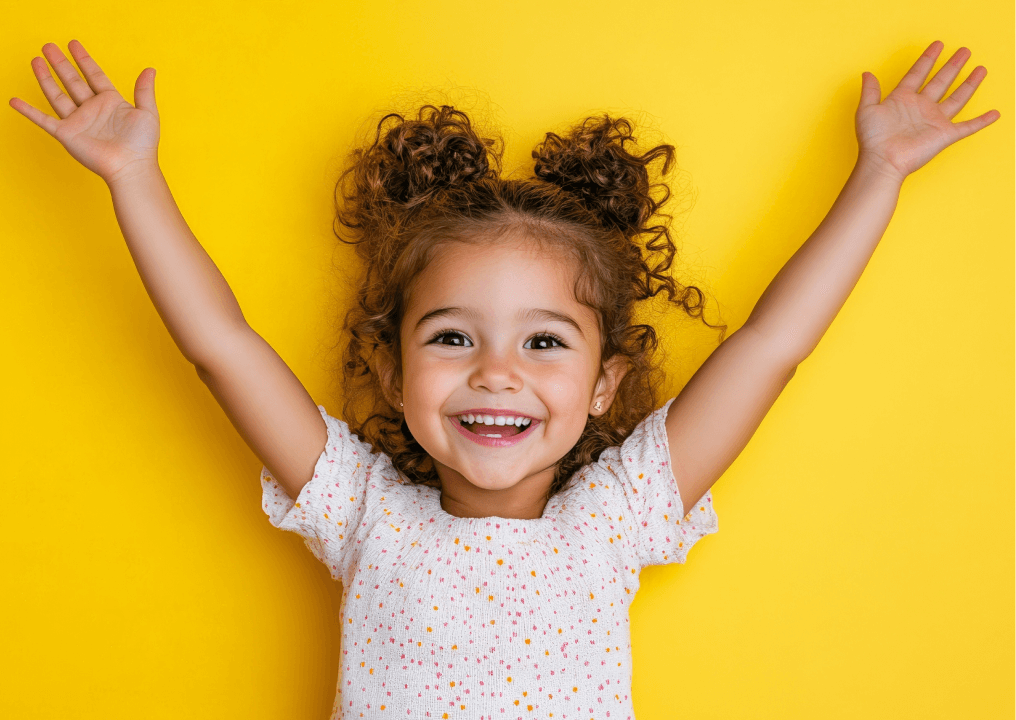 girl with her arms raised in the air