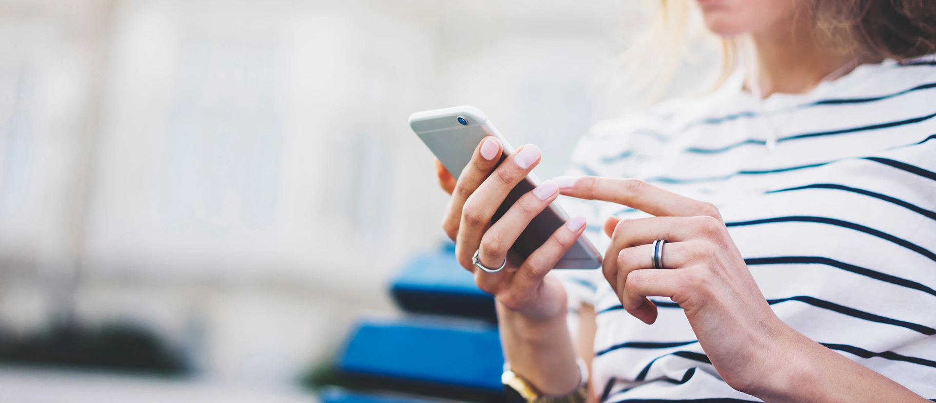 Woman's hand holding a cell phone