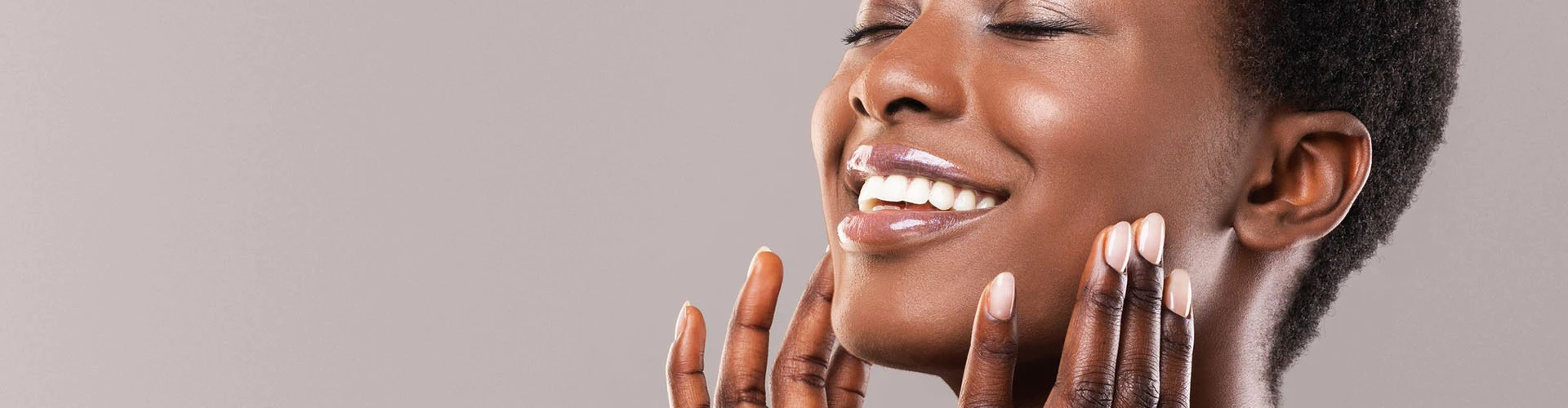 Close up of woman's smiling face looking to the side