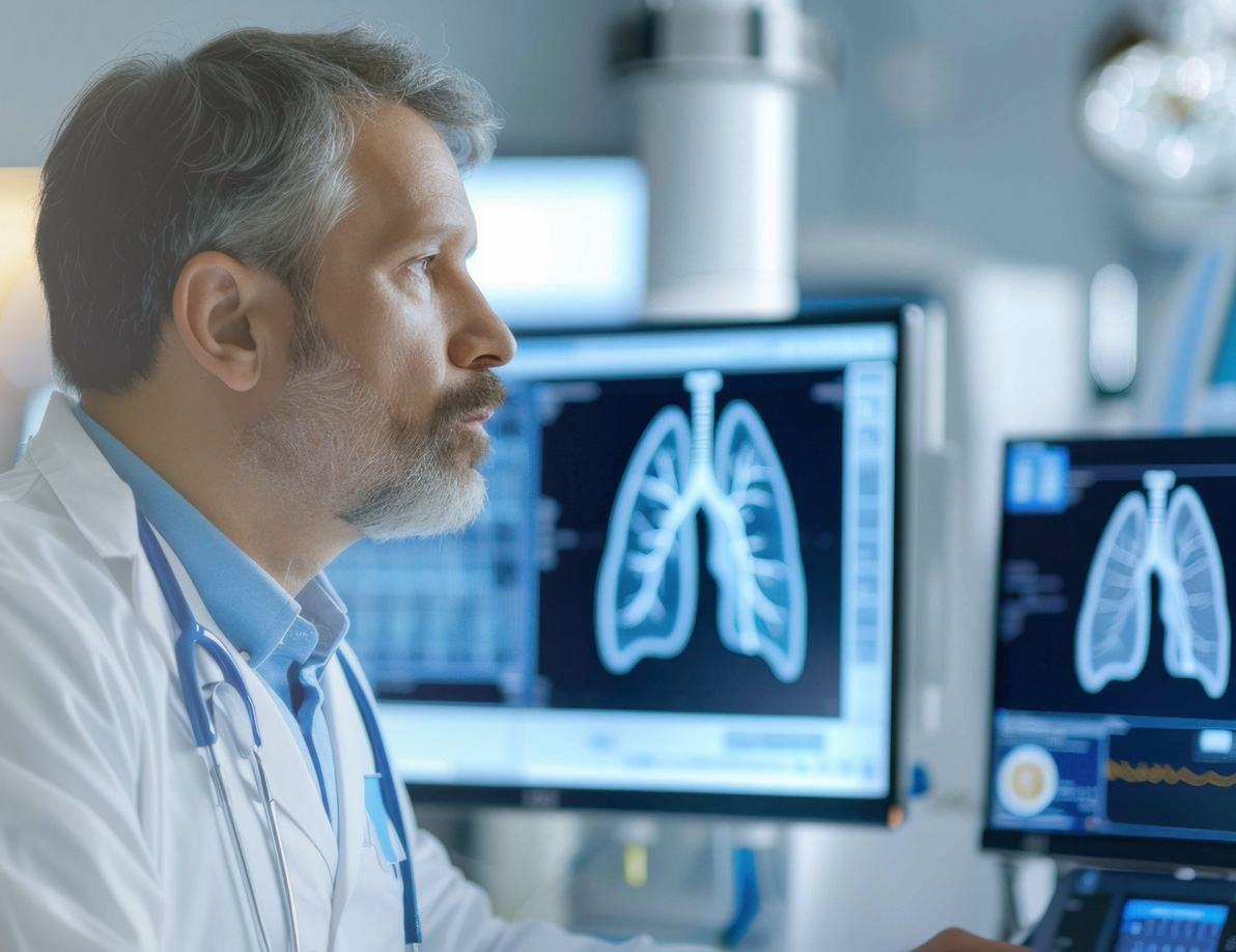 Doctor reviewing patient lung scans