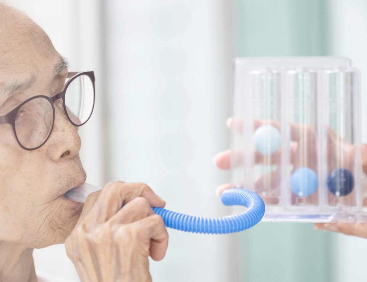 Patient using a breathing tool