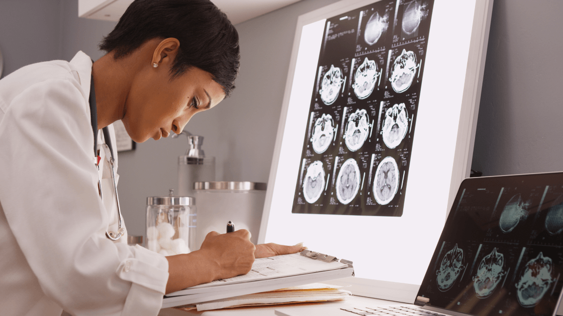 Female doctor writing notes