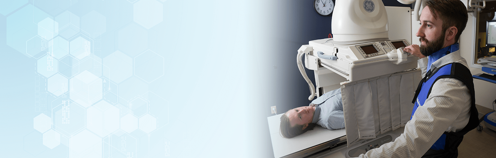 A technician in a lab with a male patient