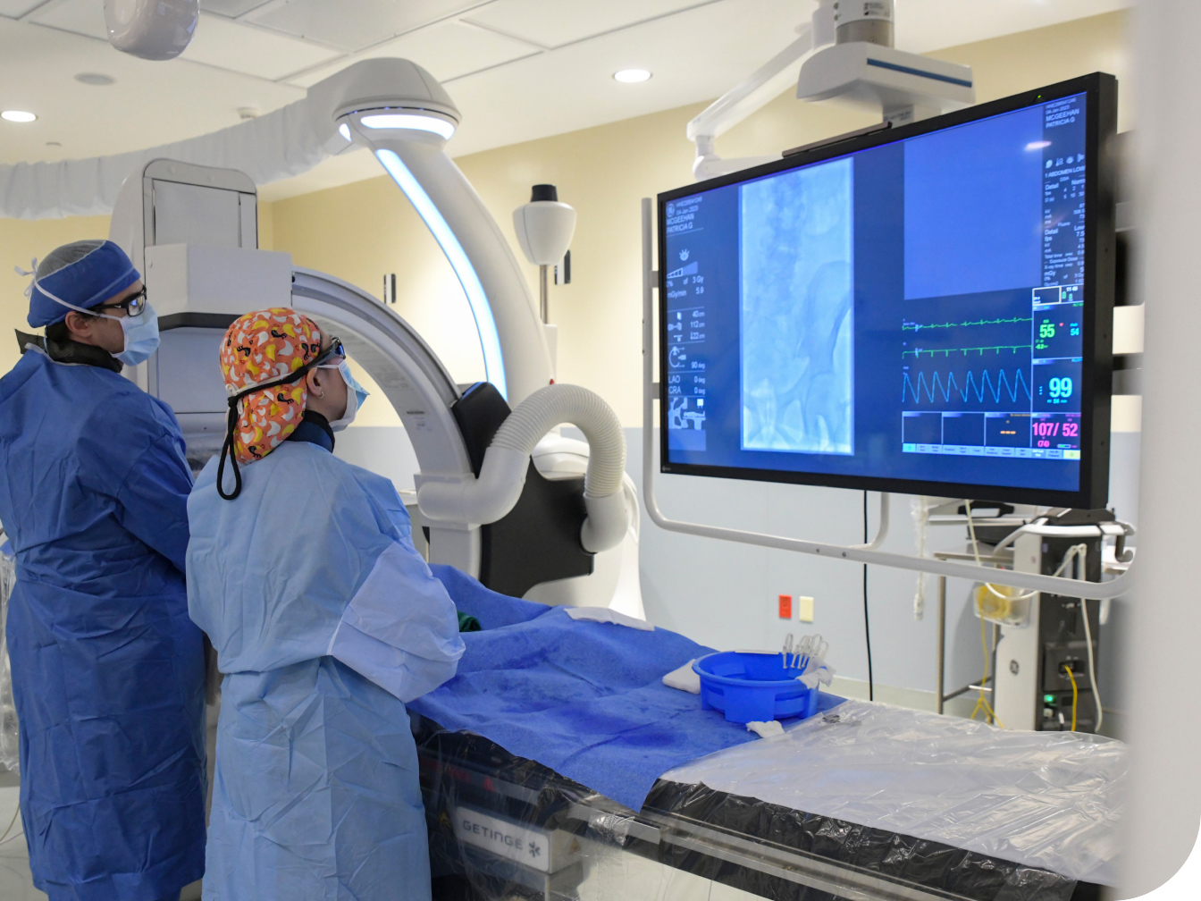 Two Medical Professionals reviewing a digital screen of results
