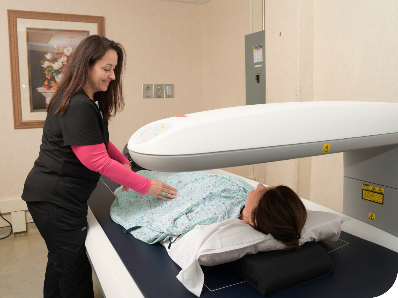 Medical Professional assisting patient with a scan