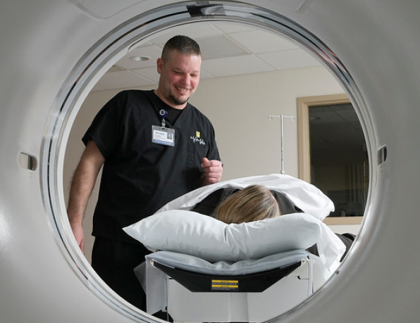 Medical Professional assisting a patient in a CT scan