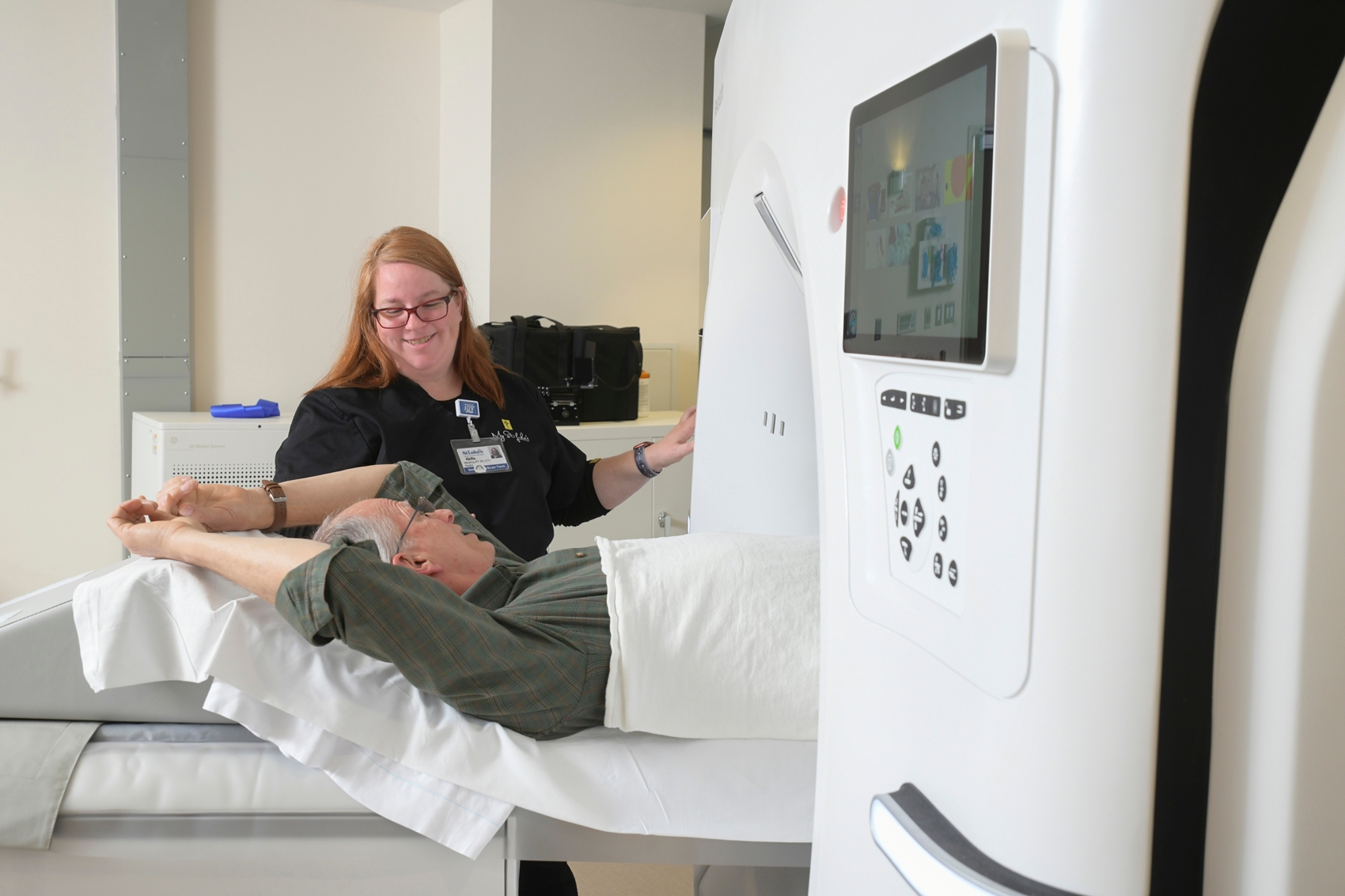 Medical Professional assisting a patient with a scan