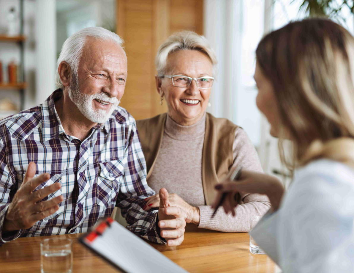 Seniors talking with a care specialist