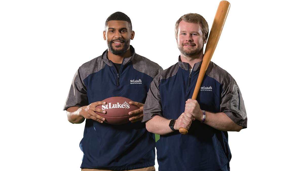 2 male sports coaches holding a football and baseball bat