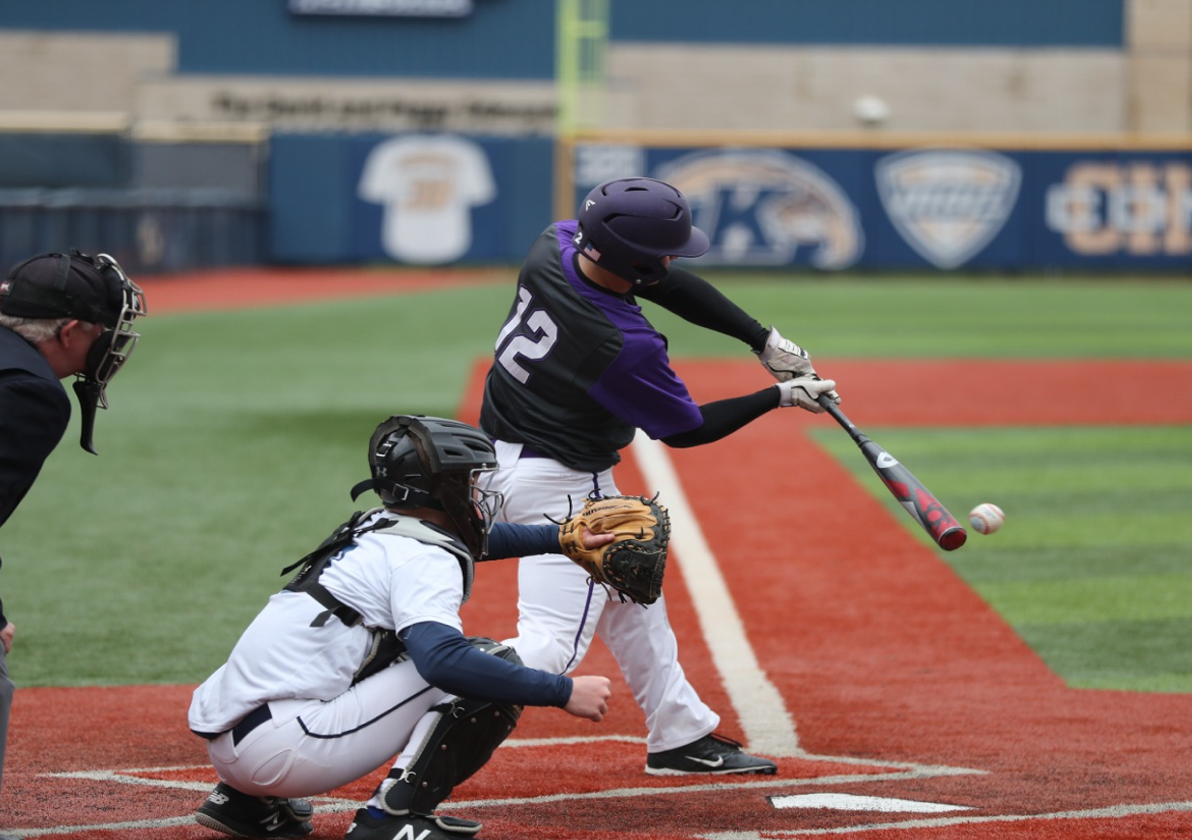 Baseball player hitting a ball during a baseball game