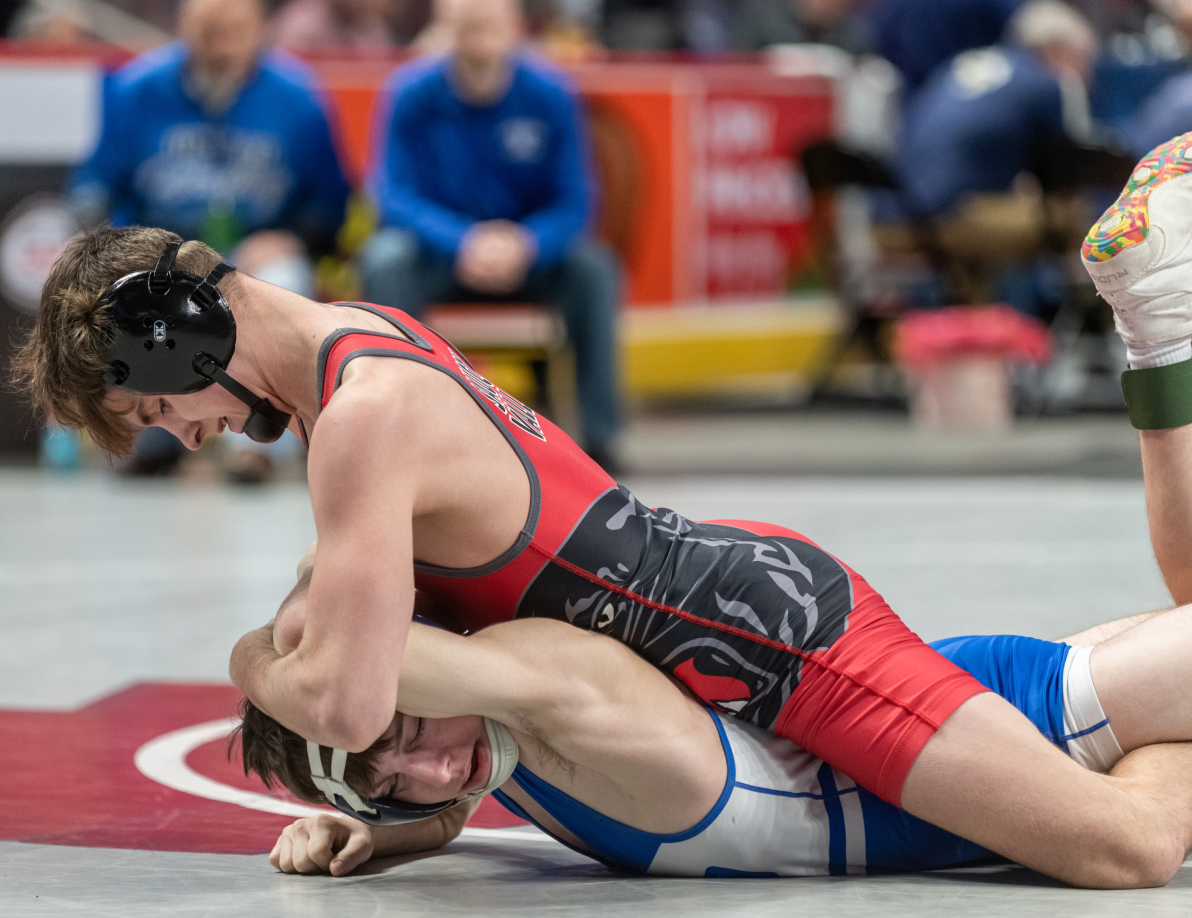 2 male wrestlers in a wrestling match