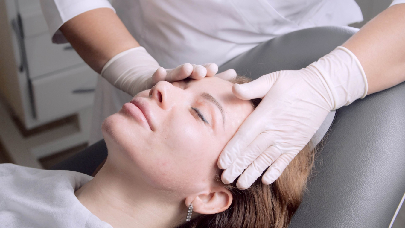 Woman receiving a facial massage