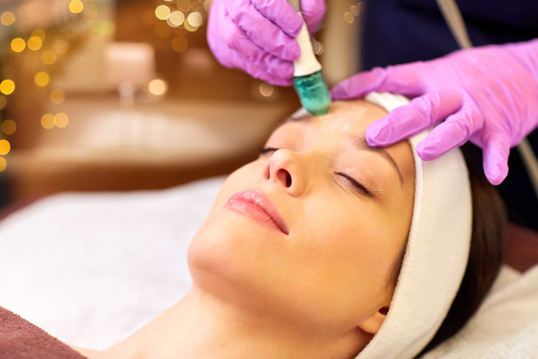Woman receiving microdermabrasion at a medical spa