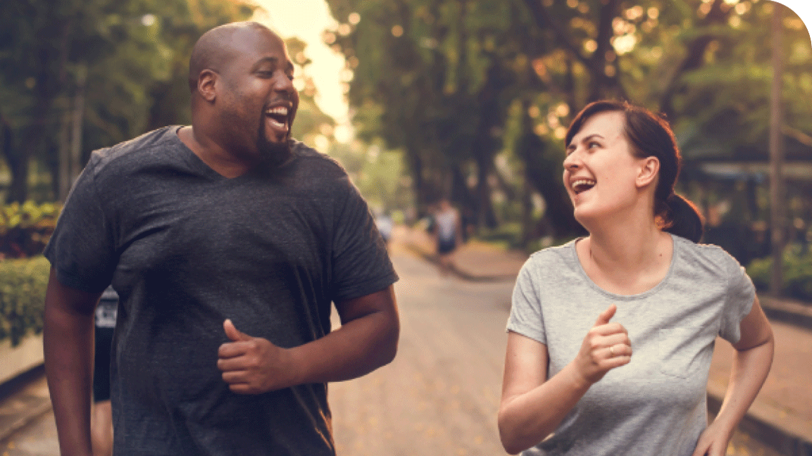 Two individuals joyfully running together