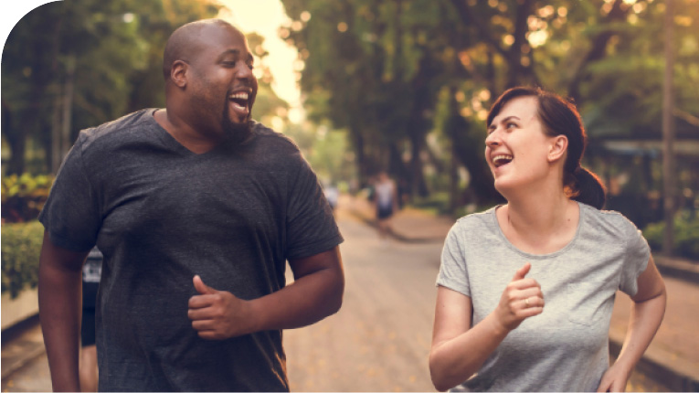 Two individuals joyfully running together