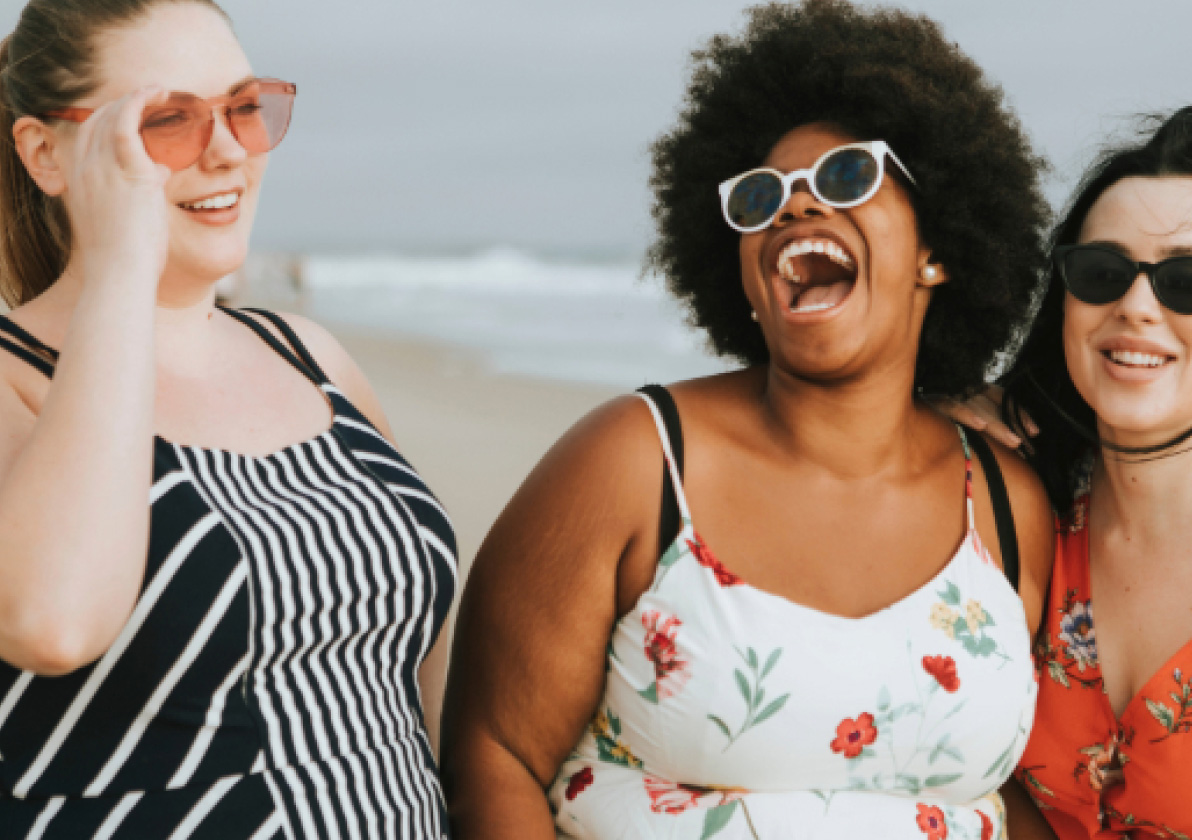 Group of women having a great time at the beach together