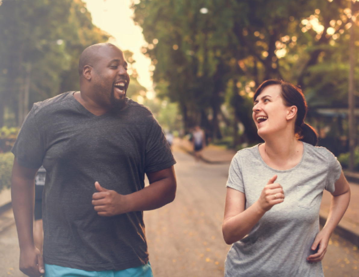 Two individuals joyfully running together